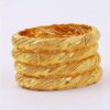 A Set of Four 24K Gold-Plated Bangles from Dubai, Designed for Women, Featuring a Twisted Style Suitable for Wedding Jewelry. - Image 4