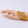 A Set of Four 24K Gold-Plated Bangles from Dubai, Designed for Women, Featuring a Twisted Style Suitable for Wedding Jewelry. - Image 4